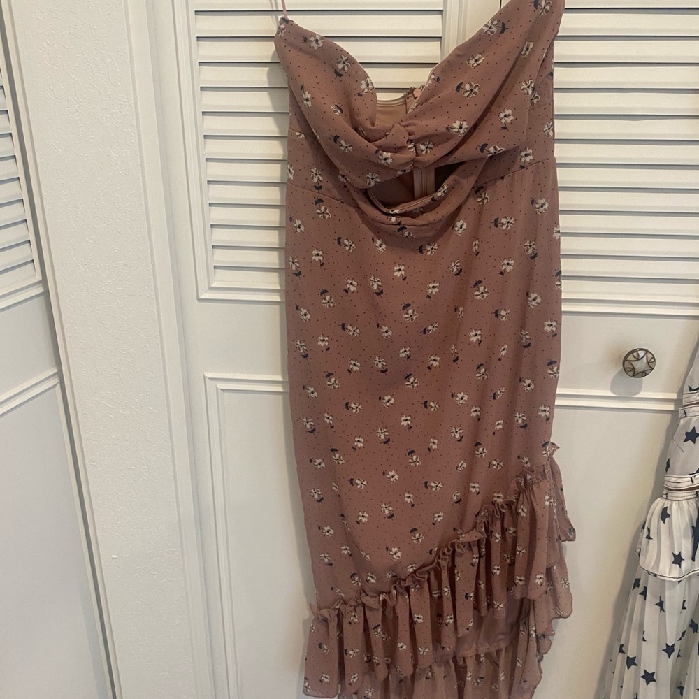 Cut out dress with asymmetrical bottom.